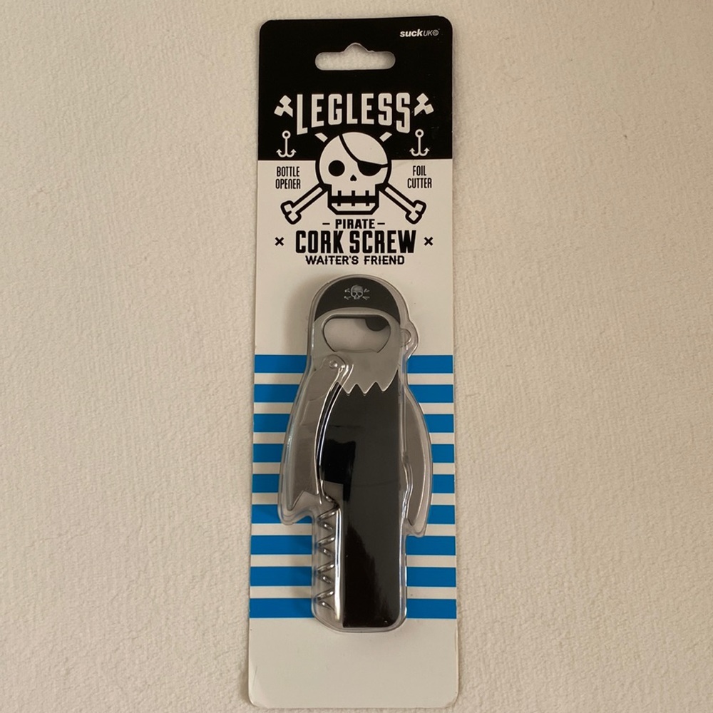 Bottle opener with cork screw and foil cutter